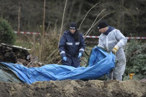 Police experts inspect the crime scene in Gimmlitztal near the town of Hartmannsdorf-Reichenau
